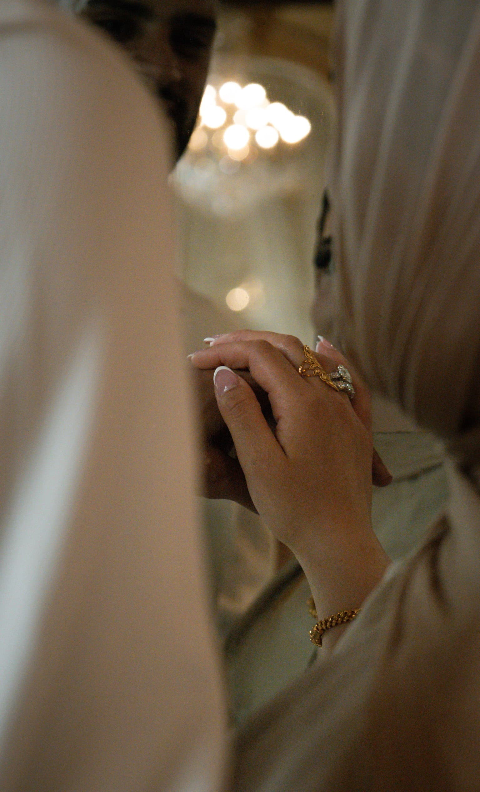 Close-up of a hand with an engagement ring, photographed by ShuhraBilNoor